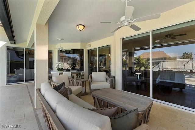 view of patio featuring an outdoor hangout area and ceiling fan