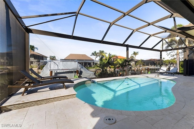 view of pool with a patio and a lanai