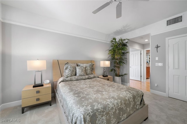 bedroom featuring light carpet and ceiling fan