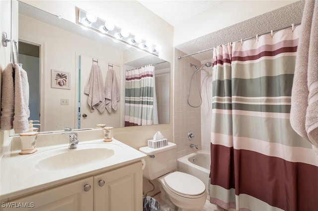 bathroom featuring toilet, shower / tub combo, and vanity