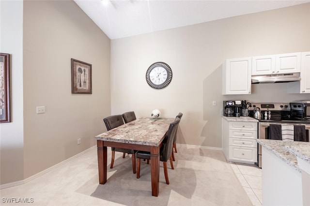 dining room featuring light tile patterned flooring and baseboards