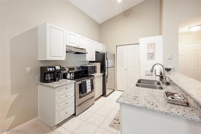 kitchen featuring a sink, under cabinet range hood, light tile patterned floors, stainless steel appliances, and white cabinets