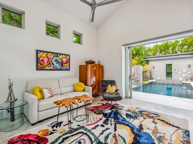 interior space with ceiling fan and high vaulted ceiling