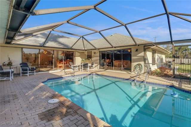 view of pool featuring a lanai and a patio area