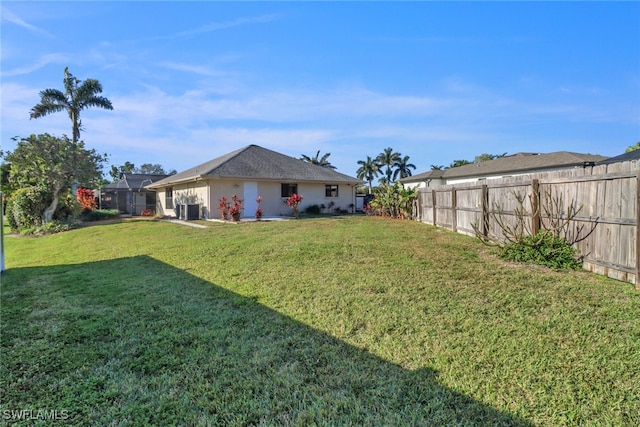 view of yard featuring a lanai and cooling unit