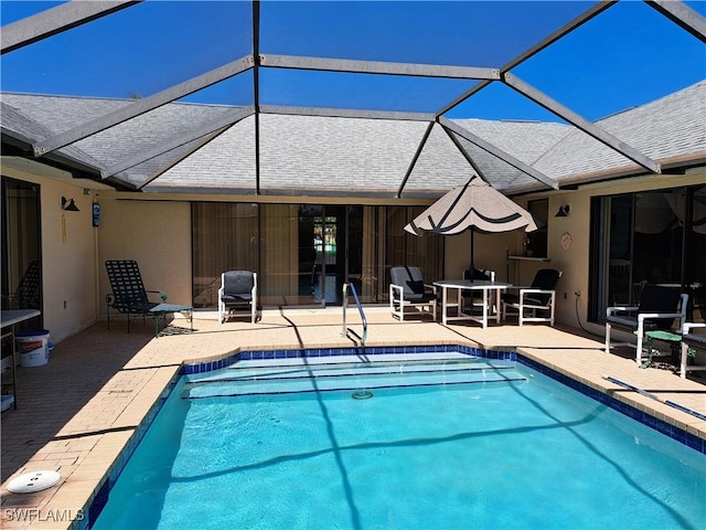 view of pool featuring a lanai and a patio