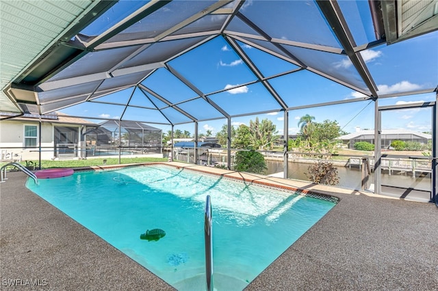 view of pool with a lanai and a patio area