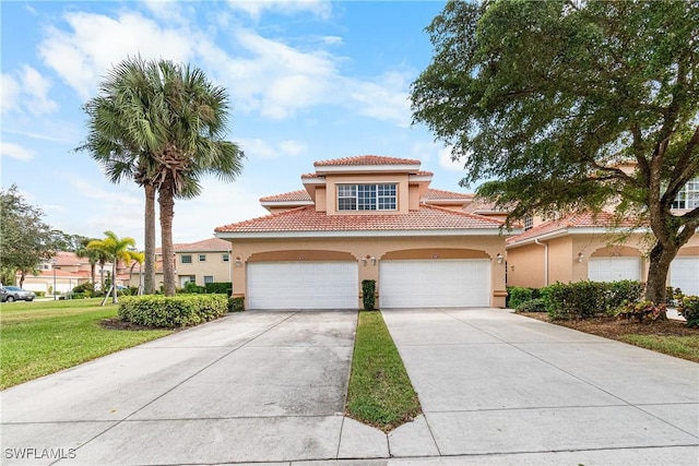 mediterranean / spanish-style house with a front yard