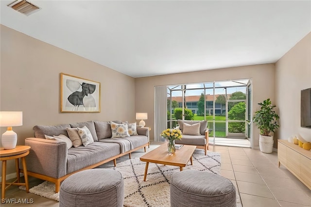 1172 Oxford Ln Unit 27, Naples, FL 34105 - living area with visible vents and light tile patterned floors