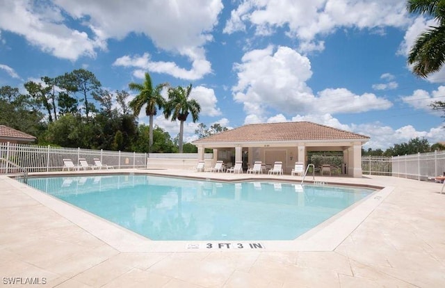 1172 Oxford Ln Unit 27, Naples, FL 34105 - community pool with a patio, a gazebo, and fence