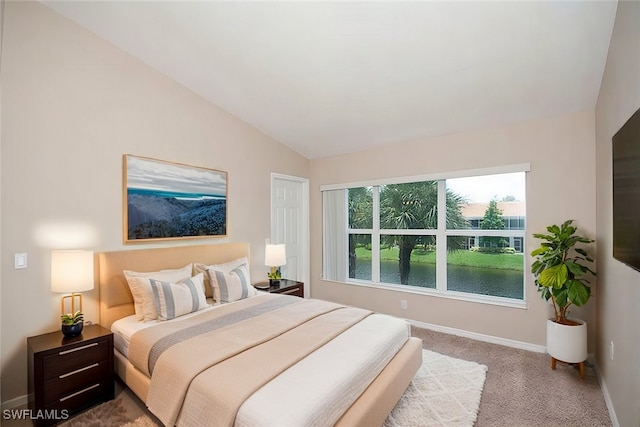 1172 Oxford Ln Unit 27, Naples, FL 34105 - carpeted bedroom featuring lofted ceiling and baseboards