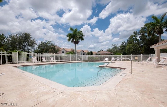 1172 Oxford Ln Unit 27, Naples, FL 34105 - pool with a patio area and fence