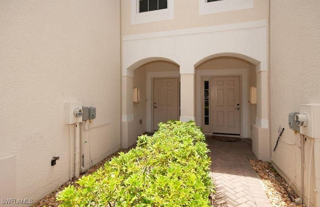1172 Oxford Ln Unit 27, Naples, FL 34105 - entrance to property with stucco siding