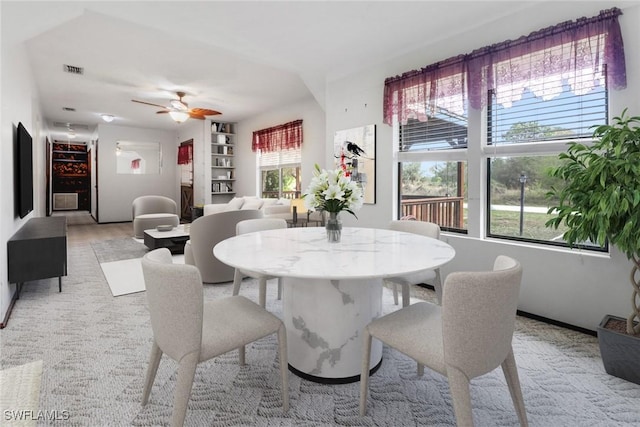 dining area featuring ceiling fan and visible vents