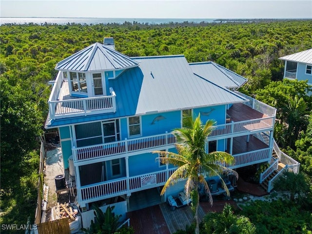 621 Rum Rd, Captiva, FL 33924 - aerial view of property and surrounding area with a forest