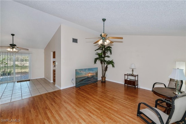 4001 E Sunflower Cir, Labelle, FL 33935 - living area with visible vents, vaulted ceiling, a ceiling fan, and wood finished floors