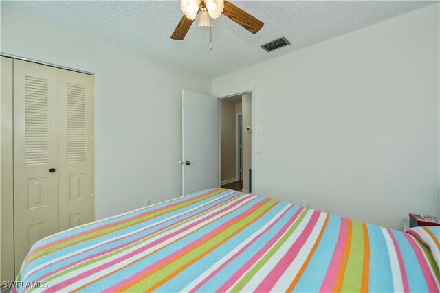 4001 E Sunflower Cir, Labelle, FL 33935 - unfurnished bedroom featuring visible vents, a closet, ceiling fan, and a textured ceiling