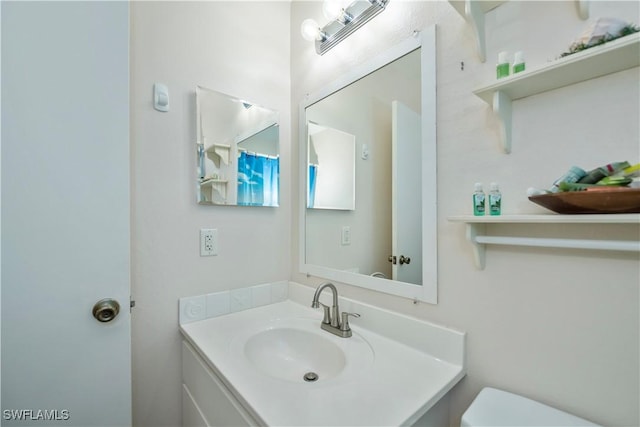 4001 E Sunflower Cir, Labelle, FL 33935 - bathroom with toilet and vanity
