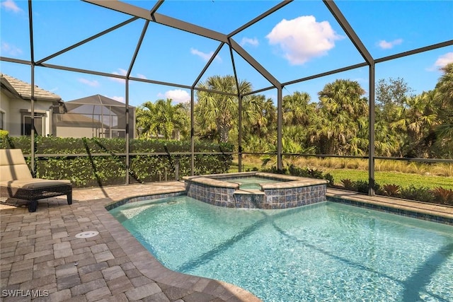 view of swimming pool featuring a lanai, a patio area, and an in ground hot tub