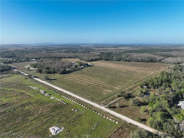 birds eye view of property featuring a rural view