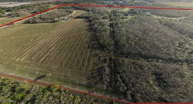 birds eye view of property with a rural view