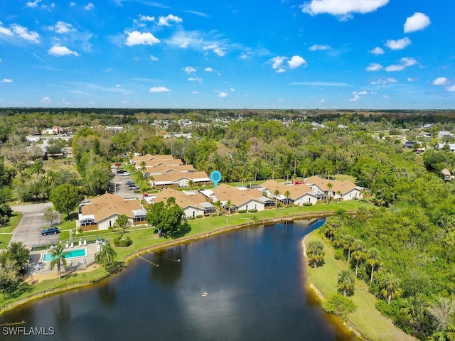 drone / aerial view featuring a water view and a residential view