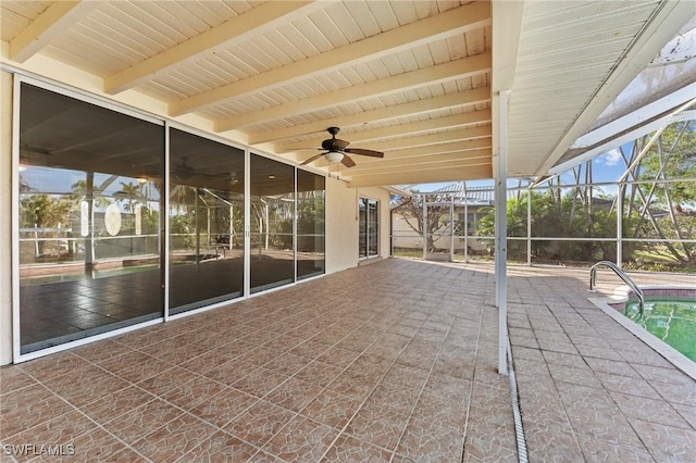 view of patio / terrace with ceiling fan and glass enclosure