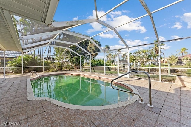 view of pool featuring a lanai and a patio area