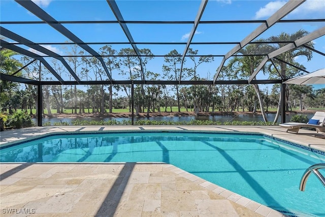 view of swimming pool with a water view, a patio, and glass enclosure