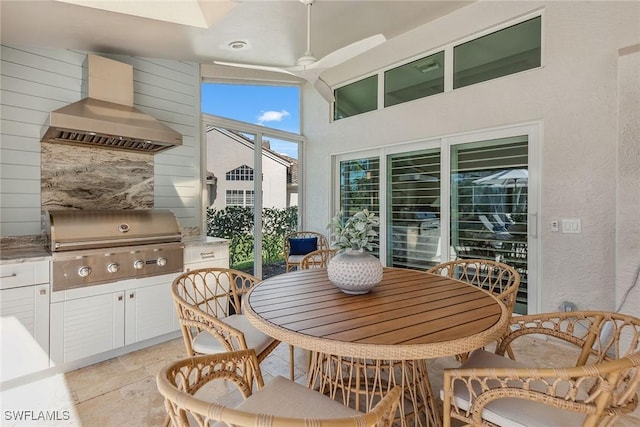 view of patio / terrace featuring ceiling fan, a grill, and exterior kitchen