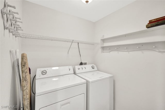 washroom featuring washing machine and clothes dryer