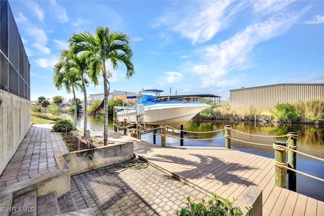 dock area with a water view and glass enclosure