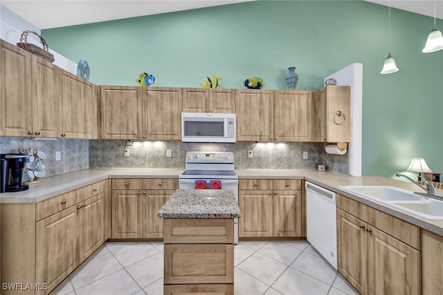 kitchen with sink, backsplash, pendant lighting, light tile patterned floors, and white appliances