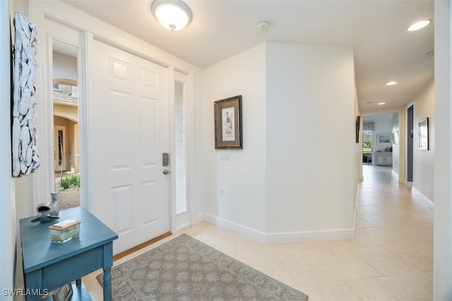 foyer with light tile patterned flooring