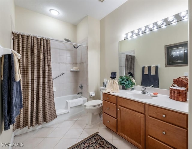 full bath featuring toilet, tile patterned flooring, shower / bath combo, and vanity