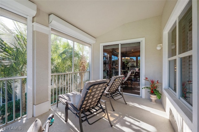 sunroom / solarium with vaulted ceiling