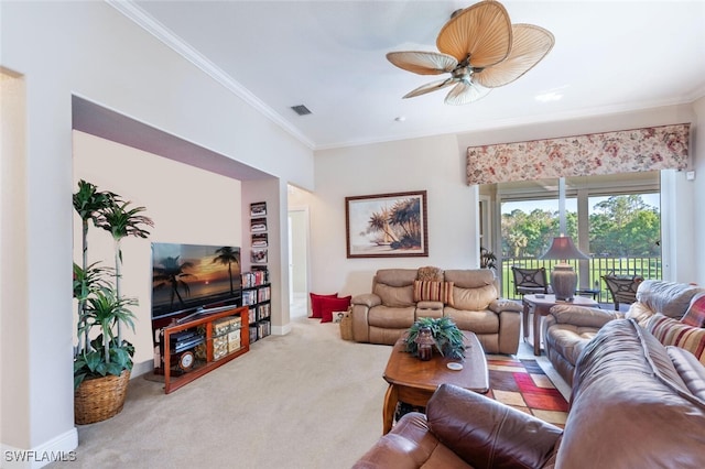 carpeted living area featuring ornamental molding, visible vents, ceiling fan, and baseboards