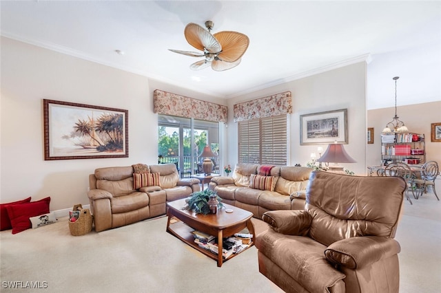 carpeted living room with ornamental molding and a ceiling fan