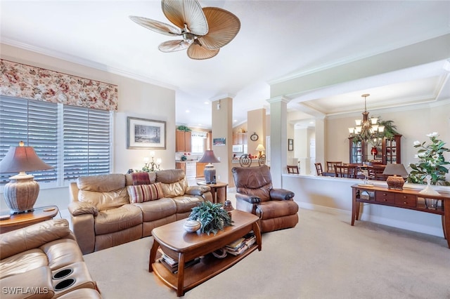 living area featuring ceiling fan with notable chandelier, crown molding, carpet flooring, baseboards, and ornate columns