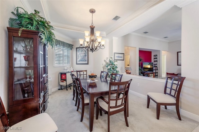 dining space featuring crown molding, baseboards, visible vents, and light colored carpet