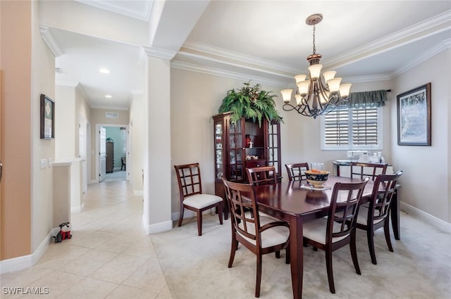 dining room featuring decorative columns, baseboards, ornamental molding, a chandelier, and light tile patterned flooring