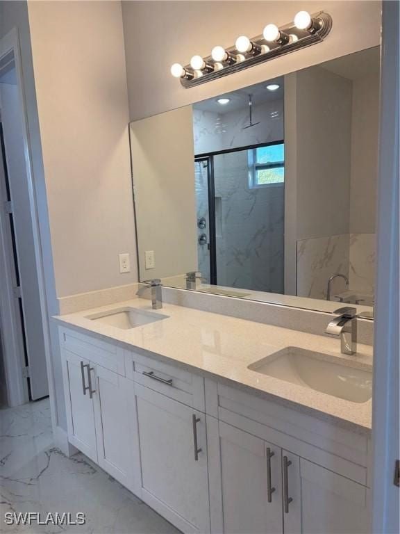 bathroom with an enclosed shower and vanity