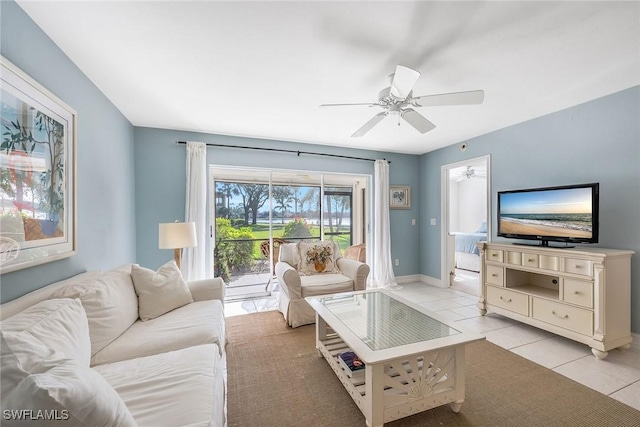 living room featuring light tile patterned floors and ceiling fan