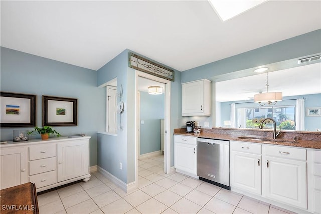 kitchen with decorative light fixtures, dishwasher, sink, white cabinets, and light tile patterned floors