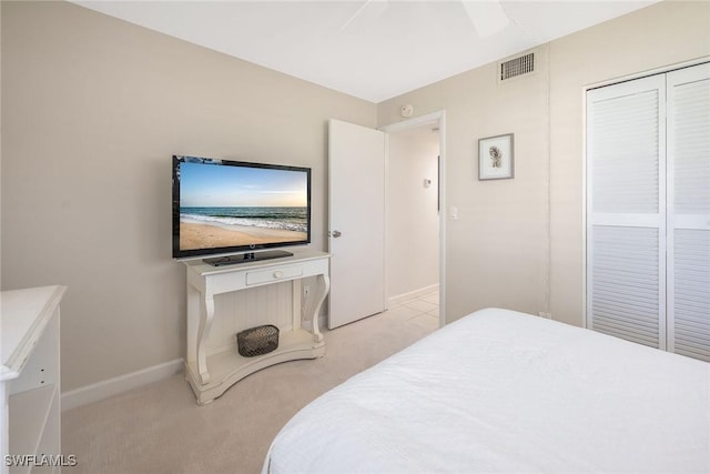 carpeted bedroom with a closet