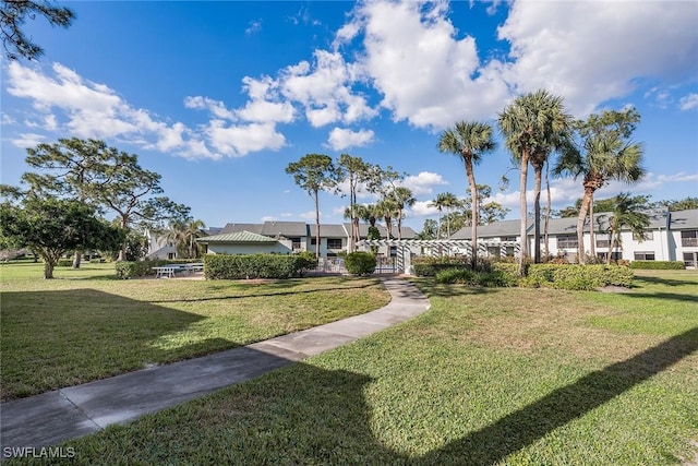 view of property's community featuring a yard