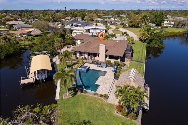 bird's eye view with a water view and a residential view