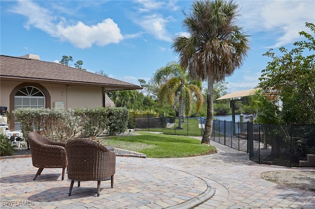 view of patio featuring fence