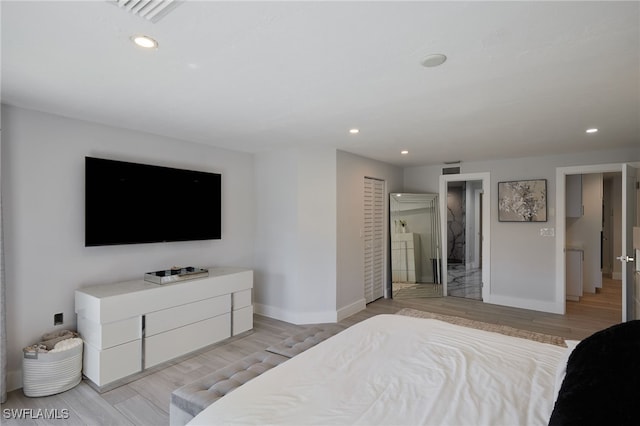 bedroom with baseboards, light wood-style flooring, and recessed lighting