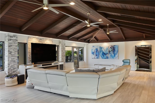 living area with vaulted ceiling with beams, light wood finished floors, ceiling fan, and wood ceiling